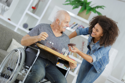 caregiver serving her senior patient