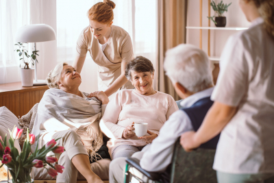 caregivers and seniors in a nursing home