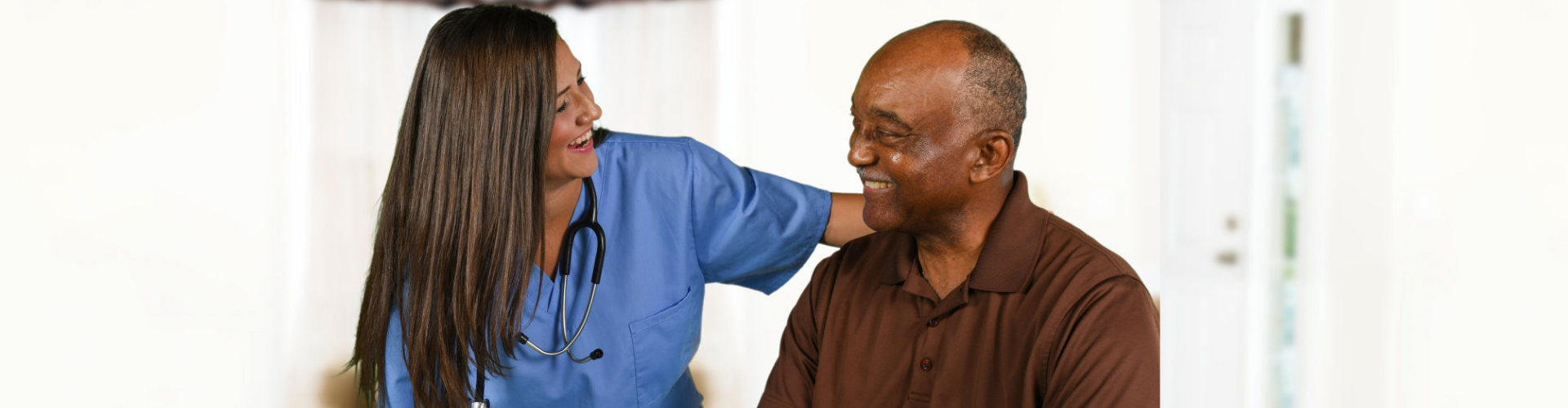 nurse and senior man having a conversation